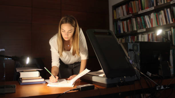 istock Young woman modern Librarian 1153259629