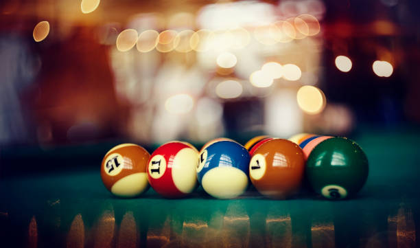 istock Colorful billiard balls on a green billiard table. 1153260450