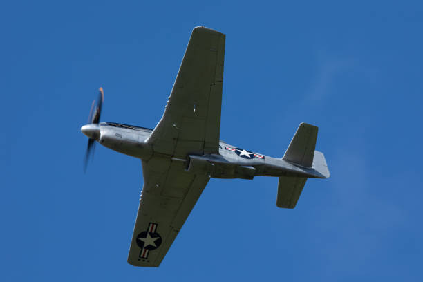 istock The unmistakable shape of a P51D Mustang (WWII American fighter plane) against the sky 1153260603