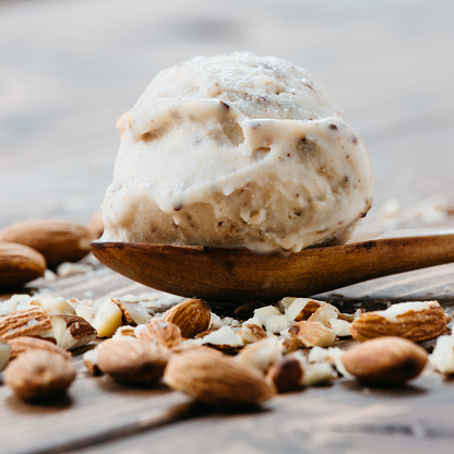 Scoop of almond ice cream on spoon