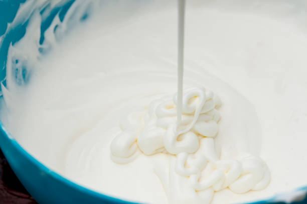 istock The white cream in the blue plastic bowl 1153262652