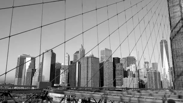 Photo of Manhattan buildings view from Brooklyn Bridge, New York, USA, black and white