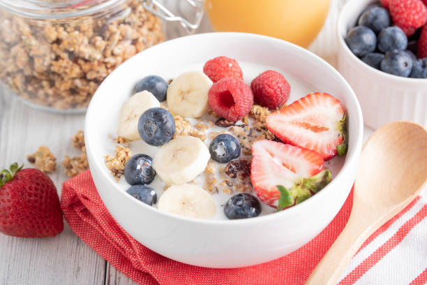 istock pouring milk in granola, breakfast image 1153266473