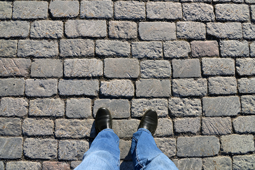 Abstract background. Cobblestone pavement close-up.