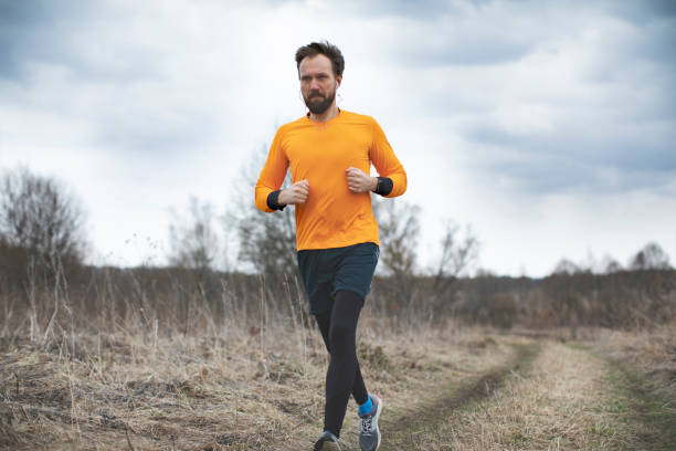 istock Young man running on the field 1153267005