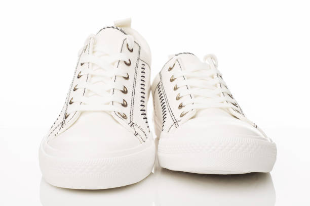 istock Fashionable white walking shoes on a white background. 1153267984