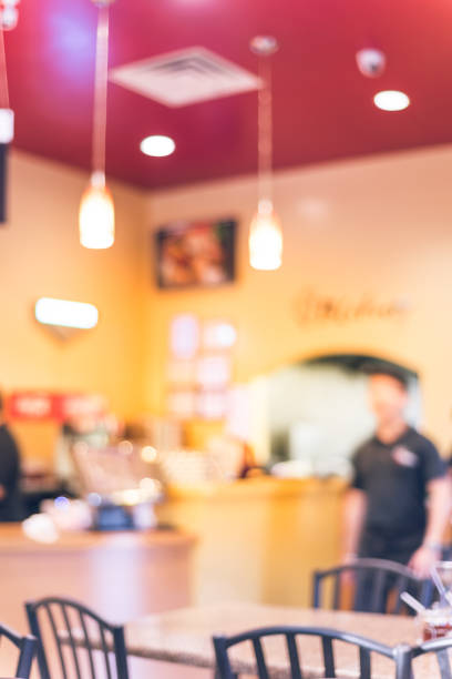 istock Blurry background waiters serving food at compact Vietnamese noodle restaurant 1153268031