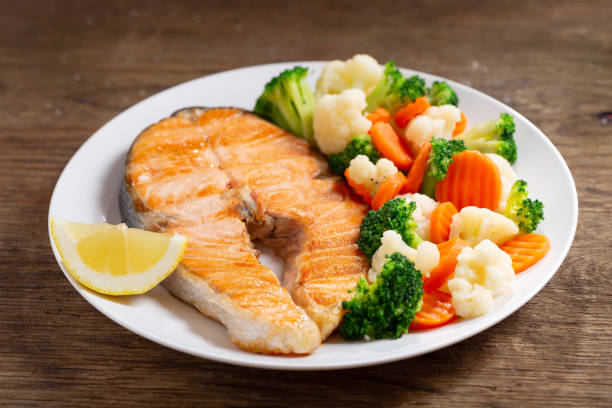 istock plate of grilled salmon steak with vegetables 1153270565