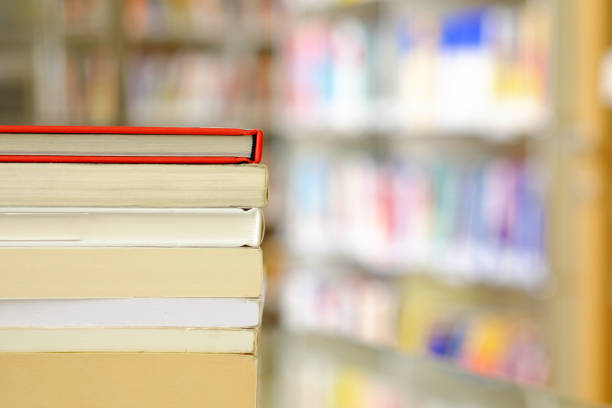 istock Stack of books on a shelf in a library 1153270604