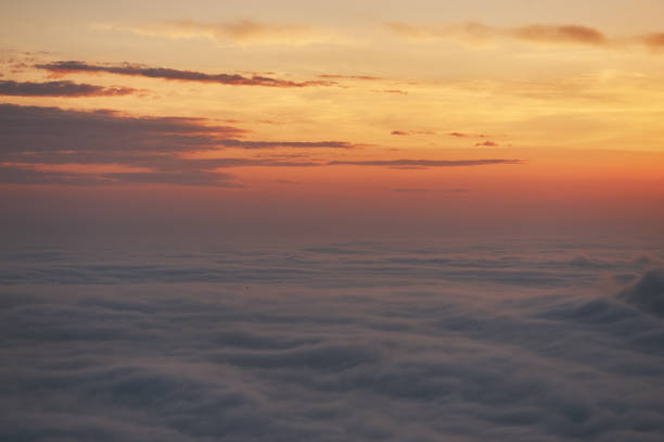 istock beautiful sunset above the clouds in the mountains. 1153270863