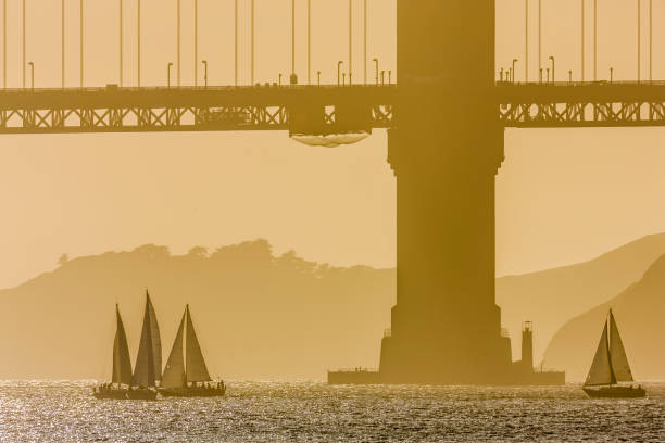 The Golden Gate Bridge in San Francisco California in late afternoon golden light seen from the Embarcadero