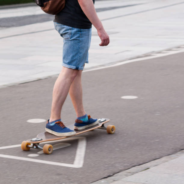 istock boy skates on the street 1153273406