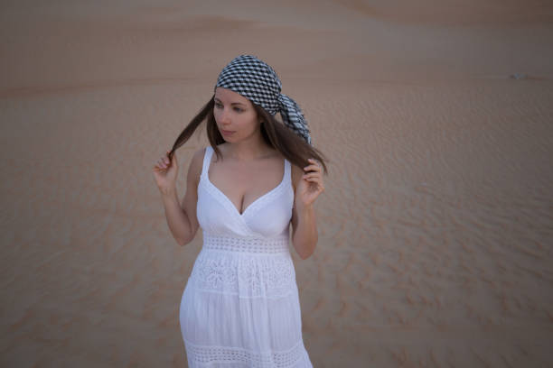 istock UAE. Woman in desert 1153274420