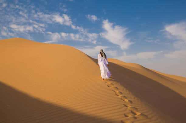istock UAE. Woman in desert 1153274612