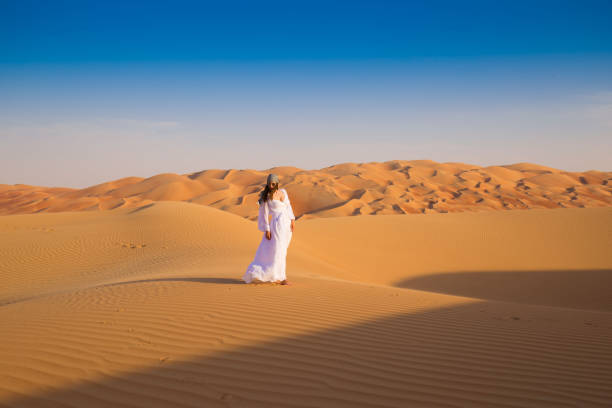istock UAE. Woman in desert 1153274617