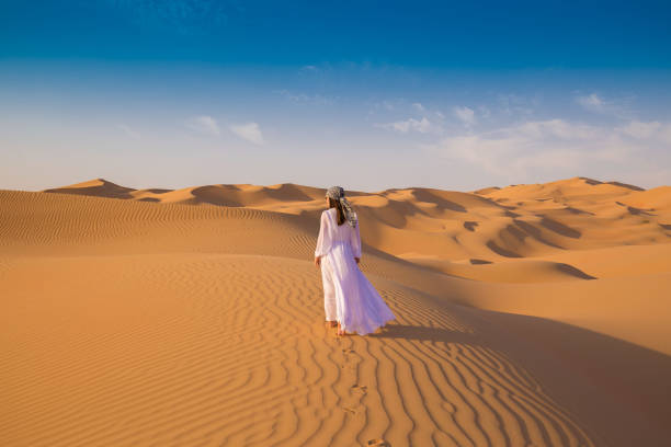 istock UAE. Woman in desert 1153274621