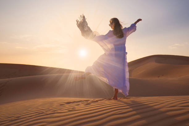 istock UAE. Woman in desert 1153274632