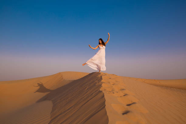 istock UAE. Woman in desert 1153274698