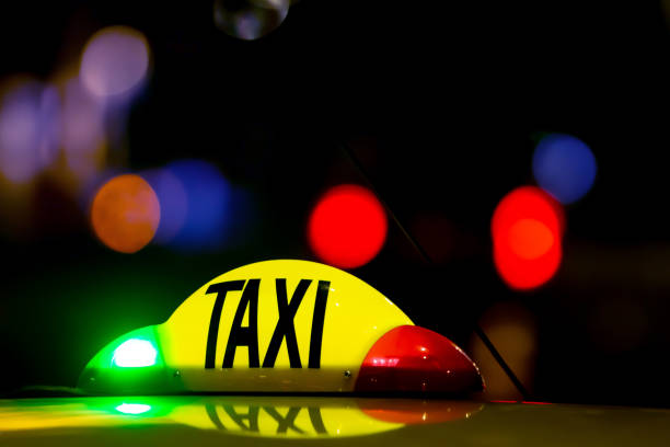 istock Taxi at night with lights signal system works. 1153276149