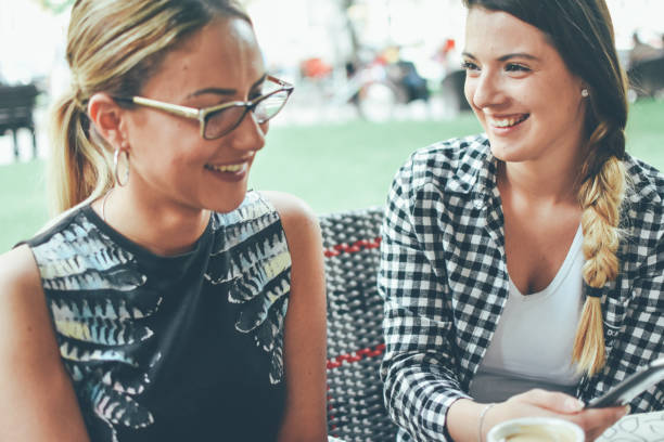 istock Female friends talking in cafe 1153276931
