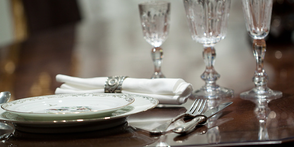 festively served table with beautiful plates and glasses