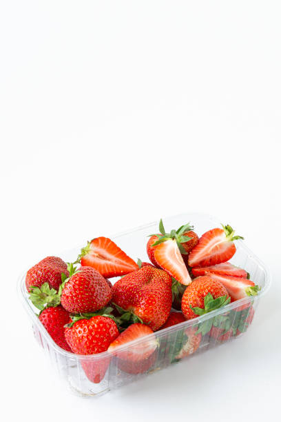 istock Strawberries in a transparent plastic package.Summer berry season.Isolated objects on white background. Benefit. 1153282497