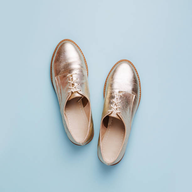 istock Stylish   shoes on pale blue background, flat lay 1153282630