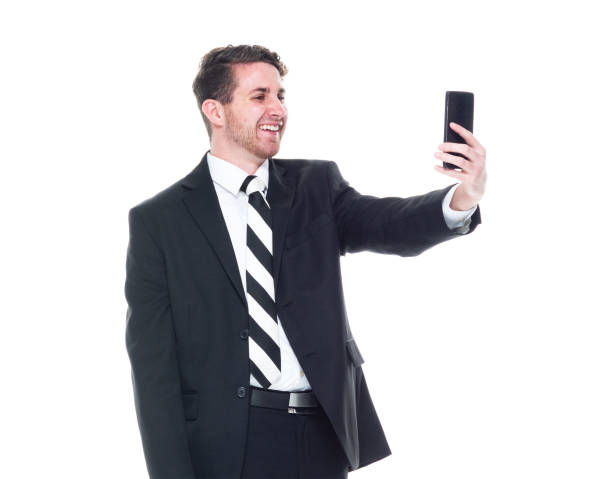 istock Young handsome businessman wearing a suit and tie - taking a selfie 1153283655