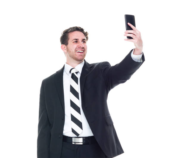 istock Young handsome businessman wearing a suit and tie - taking a selfie 1153283685