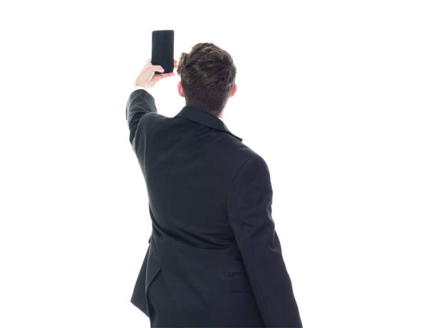 istock Young handsome businessman wearing a suit and tie - taking a selfie 1153283689