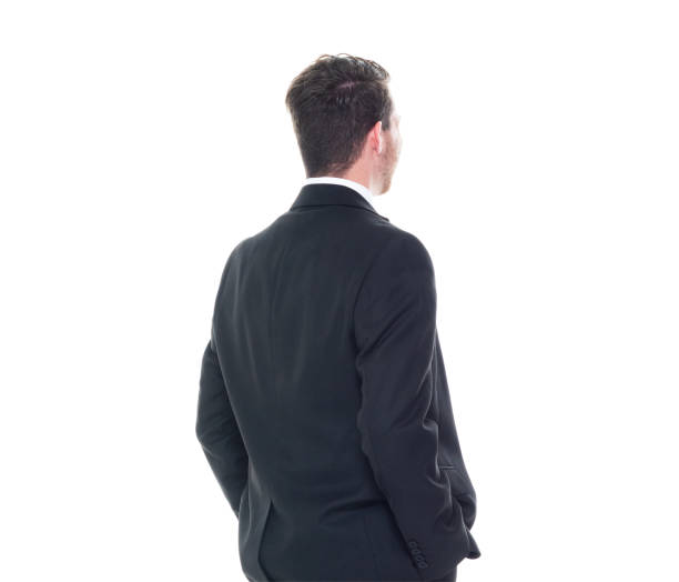 istock Young handsome businessman wearing a suit and tie - hands on hips 1153283790