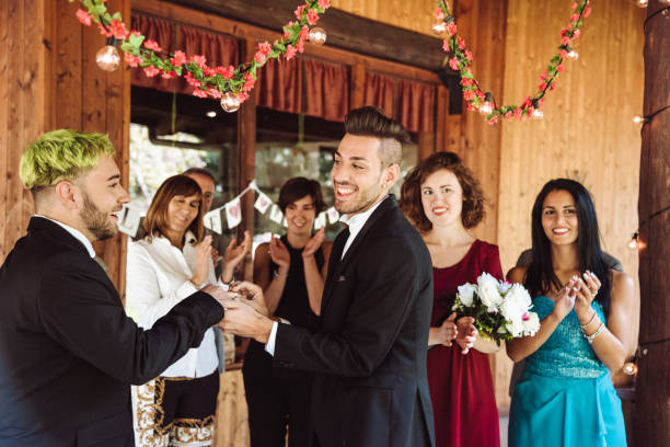 istock gay marriage, man putting the ring 1153284414