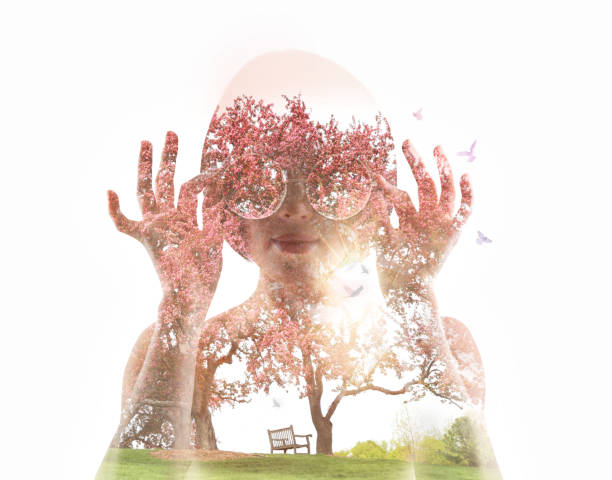 istock Multiple Exposure of young woman and apple blossoms 1153285307