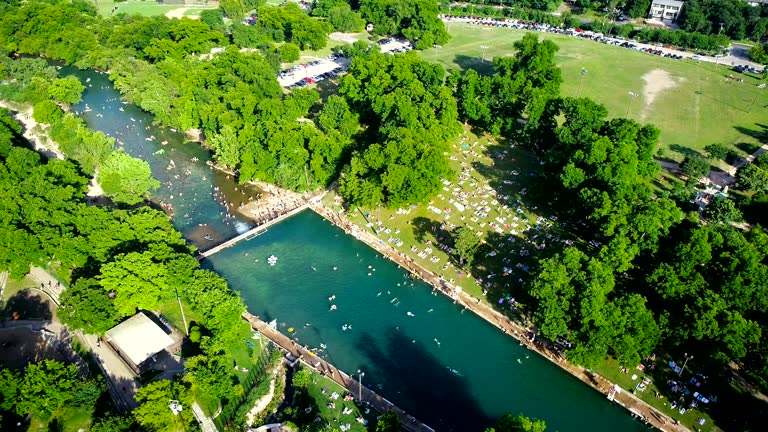 Summer Heat brings Huge Crowds Swimming at Barton Springs Pool in Austin , Texas