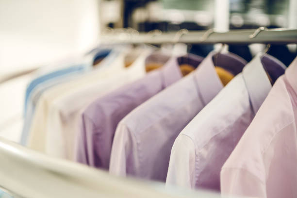 istock Men's shirts in clothing store 1153285714