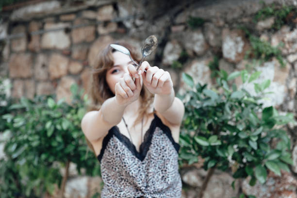 istock Young women holding spoon 1153287161
