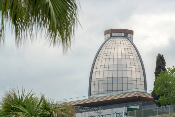 istock Modern Building with Glass, trees at cloudy day 1153289572