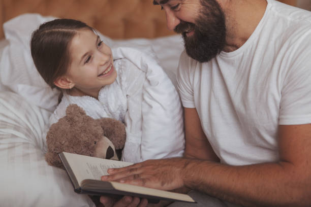 istock Father and daughter enjoying cozy day at home 1153292700