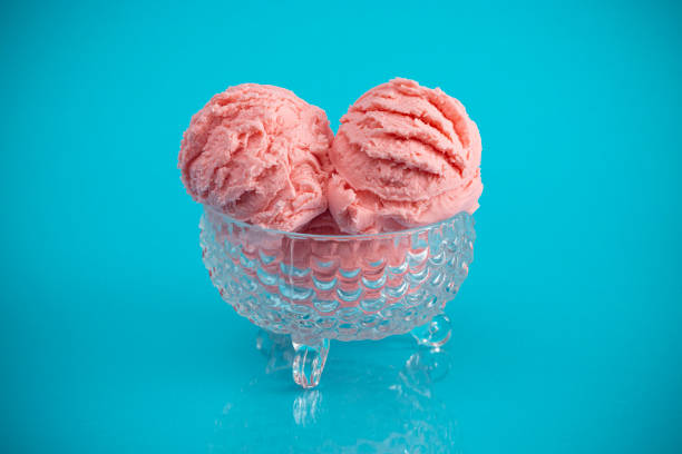 istock A Strawberry Ice Cream Sundae on a Bright Blue Background 1153292917