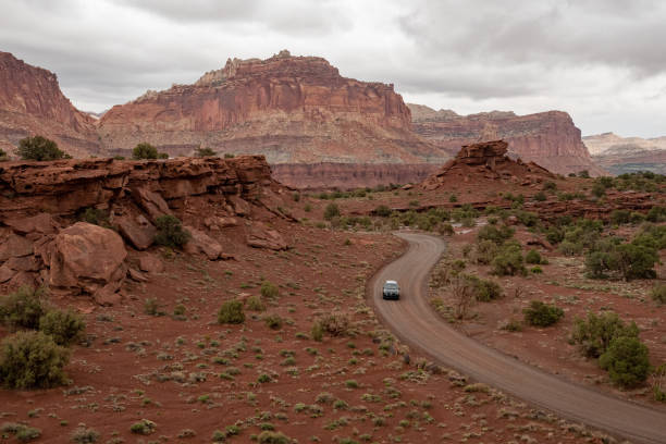 istock Car Driving on a Dirt Road in Utah 1153292963