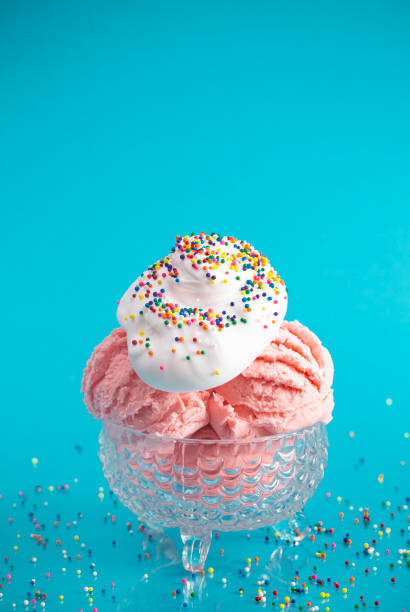 istock A Strawberry Ice Cream Sundae on a Bright Blue Background 1153292985