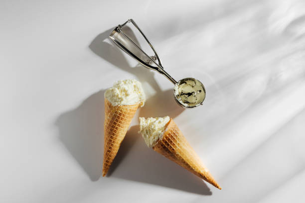 Ice cream cones with spoon on white background. Summer concept.