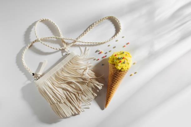 istock Small white bag with fringe and ice cream. Summer Vacation concept. 1153294429