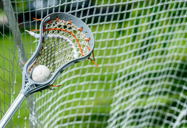 istock Abstract view of a lacrosse stick scooping up a ball 1153294761
