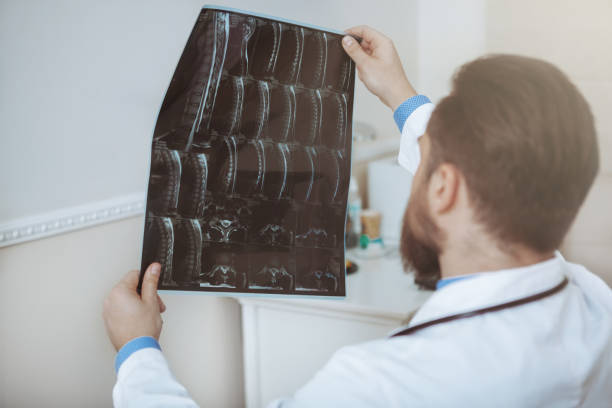 istock Bearded young doctor working at medical clinic 1153294841