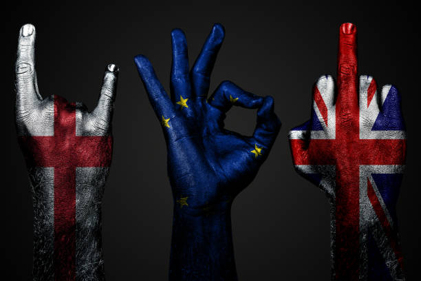 a set of three hands with a painted flag of England, United Kingdom and European Union show middle finger, goat and Okay, a sign of aggression, protest and approval on a dark background. a set of three hands with a painted flag of England, United Kingdom and European Union show middle finger, goat and Okay, a sign of aggression, protest and approval on a dark background. Horizontal frame satan goat stock pictures, royalty-free photos & images