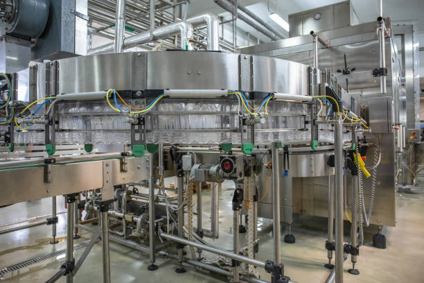 istock Empty plastic bottles move on automatic conveyor line or belt in water and juice factory or plant production 1153300084