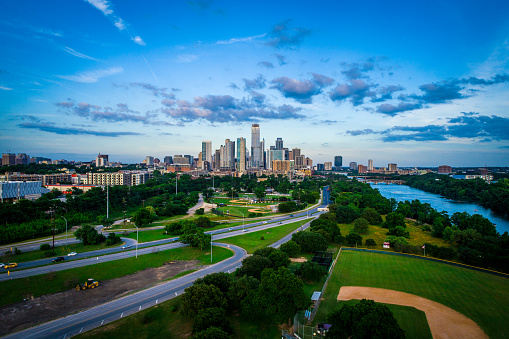 Aerial drone view  Blue hour sunset near downtown Austin Texas skyline cityscape- Green trees and green nature meets downtown