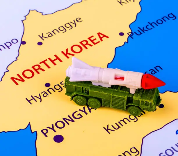 Map of North Korea with a military machine with an intercontinental missile