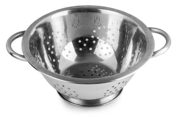 istock The old metal colander sieve isolated on white background. 1153303028
